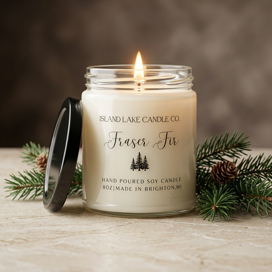 Fraser Fir candle styled with evergreen sprigs